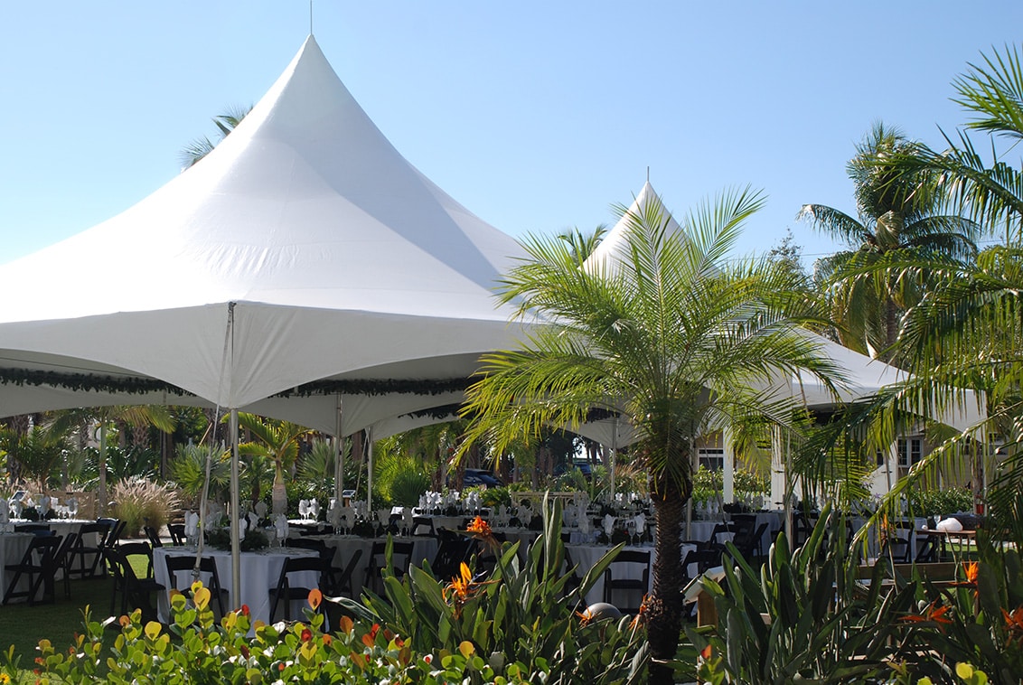 White peak tent installed at an outdoor event