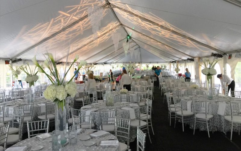 Outdoor tent party setup by Creative Events & Rentals
